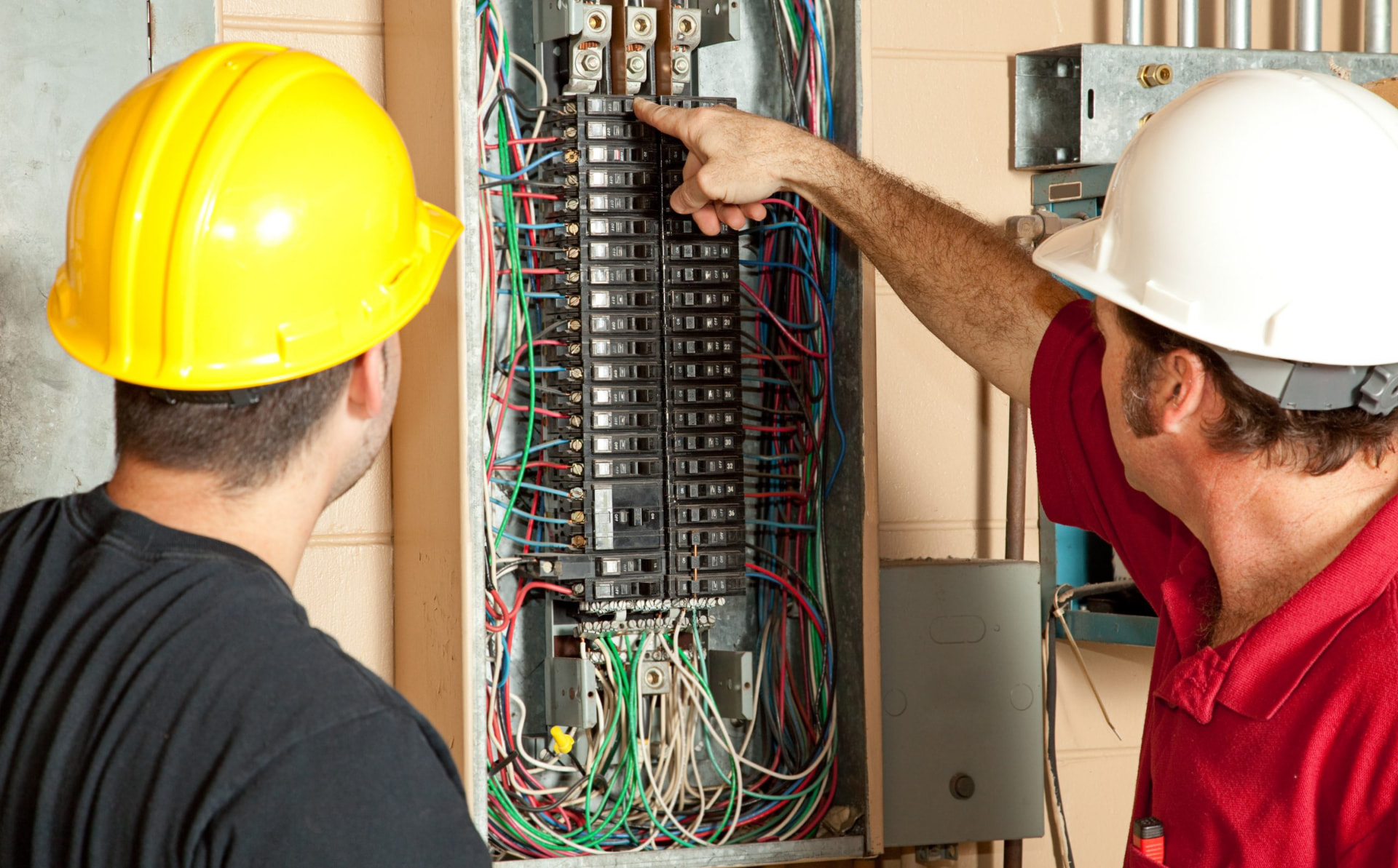Fullford electrician working on a commercial panel